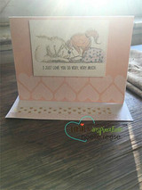 Soft pink easel card of the girl and puppy in monochrome
