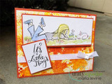 Orange inked card with the girl and bunny colored on a white panel and 'It's the Little Things' on a separate stamped panel with a white ribbon.