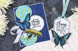 Butterflies, a caterpillar and a tag on a dark damask card, captioned "Some things are meant to be." and "Change can be a beautiful thing."