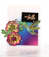 Card with a rainbow blended panel, colored flowers and a jewel-toned hummingbird beneath a black label reading 'have faith.'