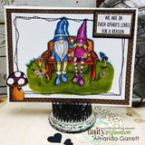 Card with two colored gnomes on a bench in a garden and 'We are in each other's lives for a reason.'