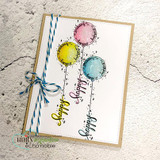 Handmade birthday card with the doodled balloons watercolored yellow, pink and blue, tied with blue twine and stamped 'happy.'
