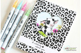 Sample card with a leopard print panel cut with a heart window revealing the colored calf beneath, stamped 'I udderly adore you' and styled with brush markers.