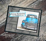 Card with a blue vintage truck on woodgrain in a black frame and "Happy Birthday to a classic guy"
