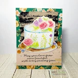 The cake in soft watercolor florals on a birch-and-floral card, reading 'May your love grow more beautiful with every passing year.'