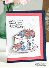 The cake with coral and blue flowers on a navy and coral layered card, reading 'Wishing a very special person a very special birthday.'