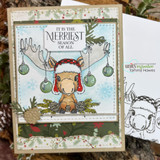 Holiday card with the moose in a Santa hat among ornaments and 'It is the merriest season of all.'