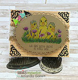 Card with the ducklings on kraft with ornate corner flourishes.