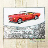 Card with a red convertible on an embossed silver background and the "all cylinders" sentiment