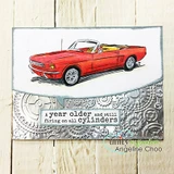 Card with a red convertible on an embossed silver background and the "all cylinders" sentiment