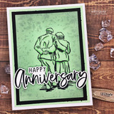 Handmade card featuring an older couple walking arm in arm, with the sentiment "A true love story never ends."