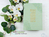 Soft green card of the gardenia border with white orchids alongside.