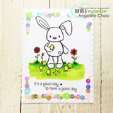 Bright card with the bunny among chicks and rainbow flowers, stamped 'it's a good day to have a good day.'