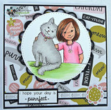 Girl in pink with her grey fluffy cat on a white circle over cat-themed word paper, sentiment 'i hope your day is purrfect'