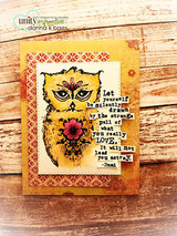 Yellow-toned folk art owl with a pink flower on a distressed red and gold patterned card, stamped 'Let yourself be silently drawn by the strange pull of what you really love. It will not lead you astray'.