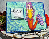 Blue bubble-textured card with a navy frame: the mermaid in orange and purple beside a “wonder” sentiment panel.