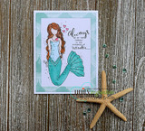 Soft mint card with a starfish: the mermaid in pale blues on a lavender panel beside the presence-of-wonder sentiment.