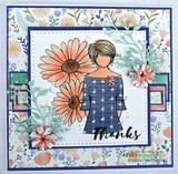 Blue floral-framed card of Daisy Girl among peach daisies, 'Thanks'