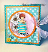 Teal polka-dot circle card of Daisy Girl with a white daisy, 'Thanks!' and ribbon