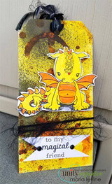 Yellow splattered tag with orange dragons and a 'to my magical friend' flag.
