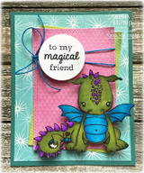 Teal starburst card with an olive dragon duo and a 'to my magical friend' circle.