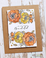 Orange and gold flower stems stamped twice on kraft-backed white card
