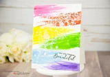 Rainbow watercolor stripes with white embossed florals. Forever beautiful resist card.