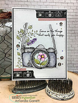 Card with the camera on white brick over chicken-wire and 'Focus on the things that make you happy.'