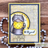 Grey cat hugging a yellow polka-dot mug on a gold circle-pattern background with a navy frame and the sentiment 'Oh so good'