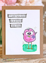 White card with a pink crazy bird in grass, 'If you're lucky enough to be different never change.'
