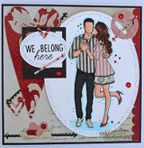 Handmade card featuring the tender AngieGirl couple embracing, on a bold red splatter background, stamped with 'Life is beautiful'.