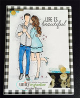 Handmade card featuring the tender AngieGirl couple embracing, over a gingham panel, stamped with 'We belong here'.
