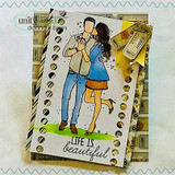 Handmade card featuring the tender AngieGirl couple embracing, on a woodgrain layered base, stamped with 'The moments are good together'.