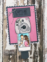 Handmade card featuring the tender AngieGirl couple embracing, with a stamped camera, stamped with 'We belong here'.