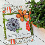 Card with the blossoms colored in orange, grey and lavender on layered floral and stripe papers, the 'May your life blossom & flourish' sentiment stamped along the bottom.