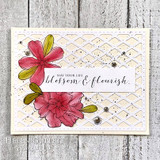 Card with two red and olive desert roses on a cream lattice embossed panel, a white strip stamped 'May your life blossom & flourish' across the center.