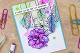 Purple poppies on a watercolor-washed card, captioned 'I think you're pretty amazing.'