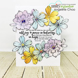 White card ringed with colored pansies around 'May the God of hope fill you with all joy & peace in believing' from Romans 15:13