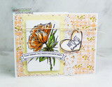 Card with two orange blooms and a handmade heart tag on plaid and floral papers, with the plant dreams, pull weeds and grow happy banner.