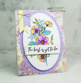 Card with a purple-and-yellow floral spray on a patterned panel, 'The best is yet to be.'