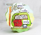 Die-cut scallop card of the green camper with string lights and a red rose, stamped 'good vibes only.'