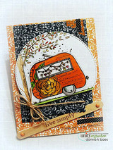 Card with the orange vintage trailer layered on patterned paper, tied with twine.