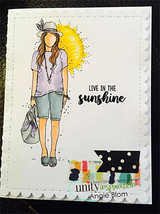 Handmade card featuring the free-spirited AngieGirl strolling with her bag, on a black-framed base with washi, stamped with 'Live in the sunshine'.