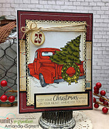 Red truck card on burgundy lace-edged panels with a '25' tag and the Christmas magic sentiment.