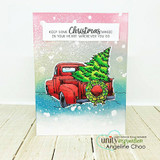Pastel snowfall card of the red truck hauling its tree under 'Keep some Christmas magic in your heart.'