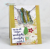 Card with scarves on a line over floral paper, 'we are all unique... wonderfully beautifully made'