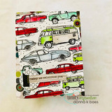 Vintage cars and vans stamped in a repeating background, colored red and green, 'today we celebrate you.'