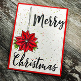 Card with a red poinsettia ornament and 'Merry Christmas.'