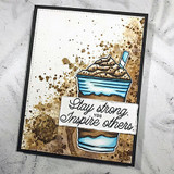 Gold-splattered black card with the coffee cup on a white panel, 'Stay strong. Inspire others'.