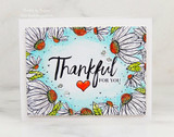 Soft blue card with the sunflower border in black line and 'Thankful for you' with a red heart.
